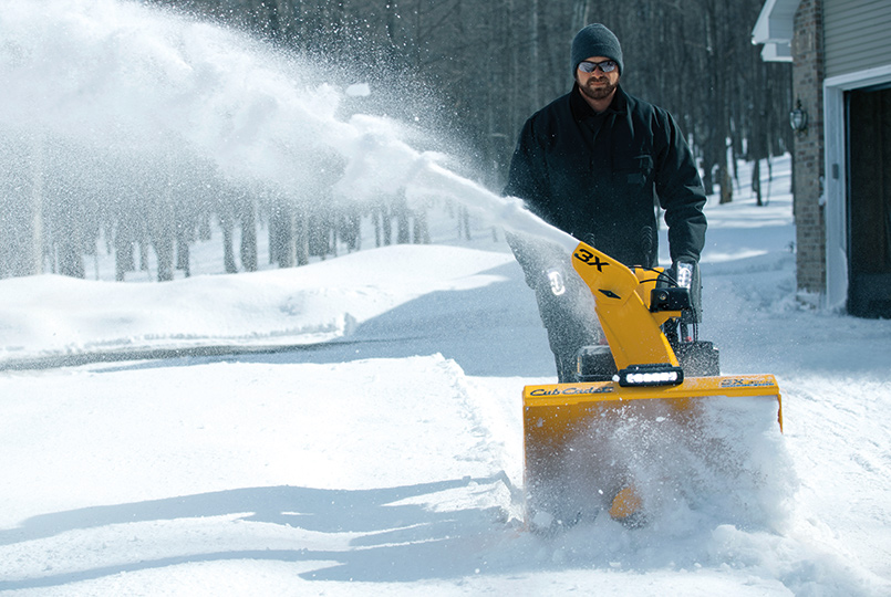 three stage snow blower discharging snow to the right