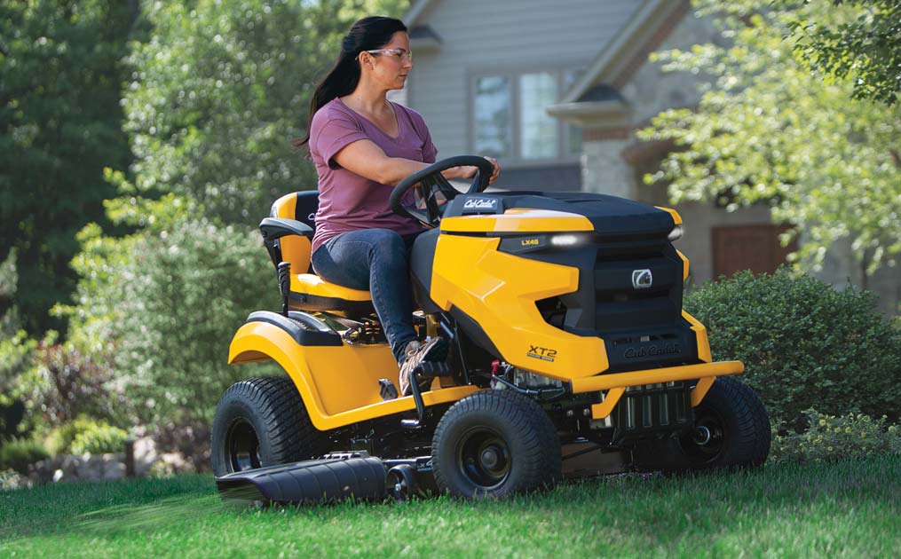 woman cutting lawn with XT2 Riding Mower