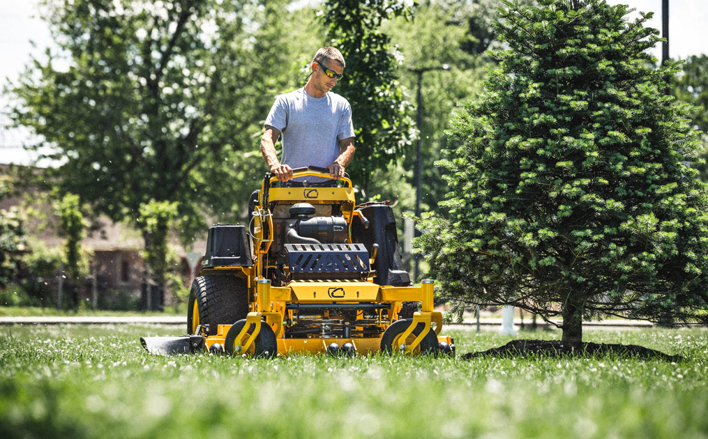 zero-turn mower plowing snow with blade