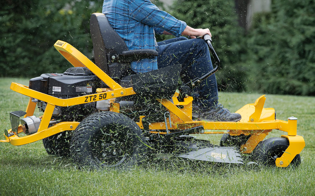 man cutting lawn with Cub cadet Ultima