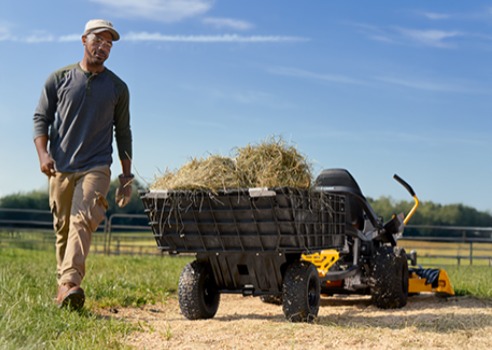 man with hay, Cub Cadet zero-turn mower for hobby enthusiasts