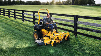 man riding commercial lawn mower